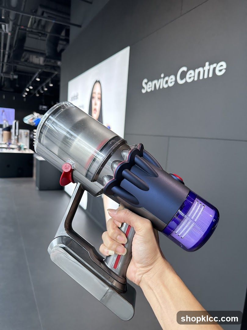 Hand holding a vacuum cleaner