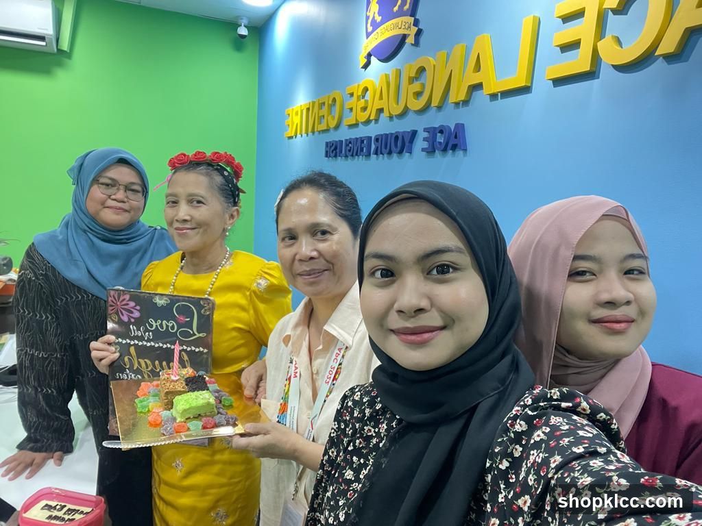 Group with Cake at ACE Language Centre