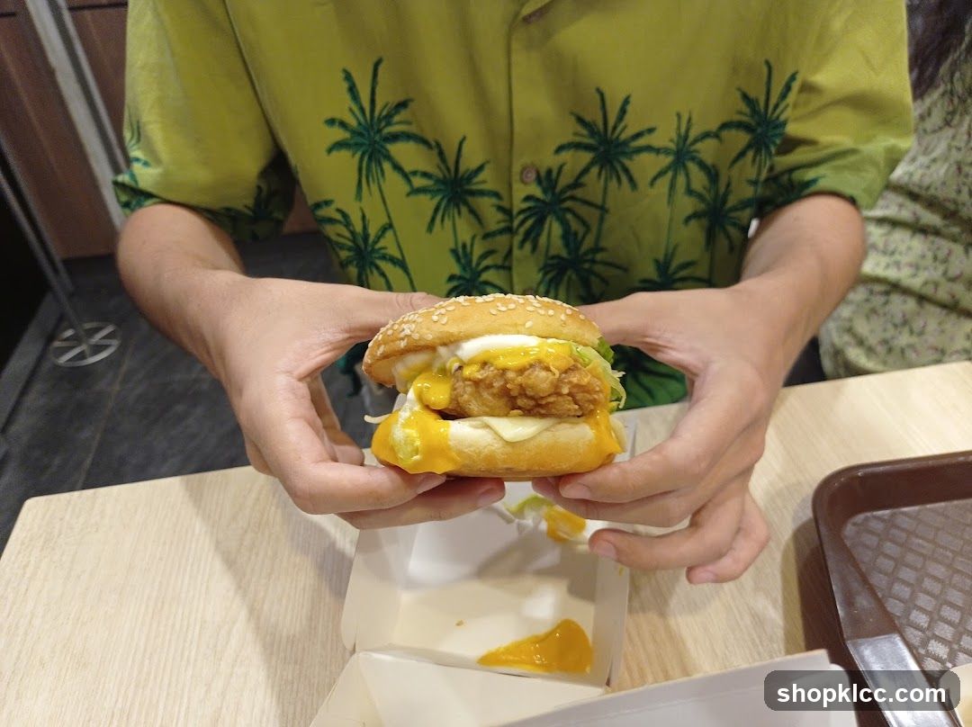 Person holding a burger