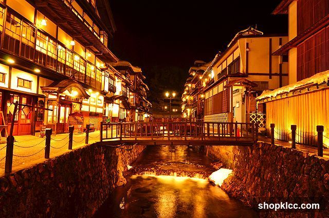 Night Street Scene with River and Traditional Buildings