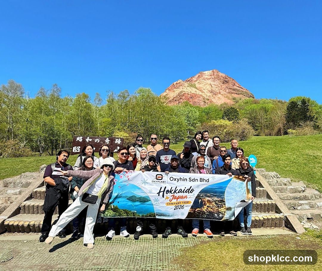 Group photo with banner at scenic location