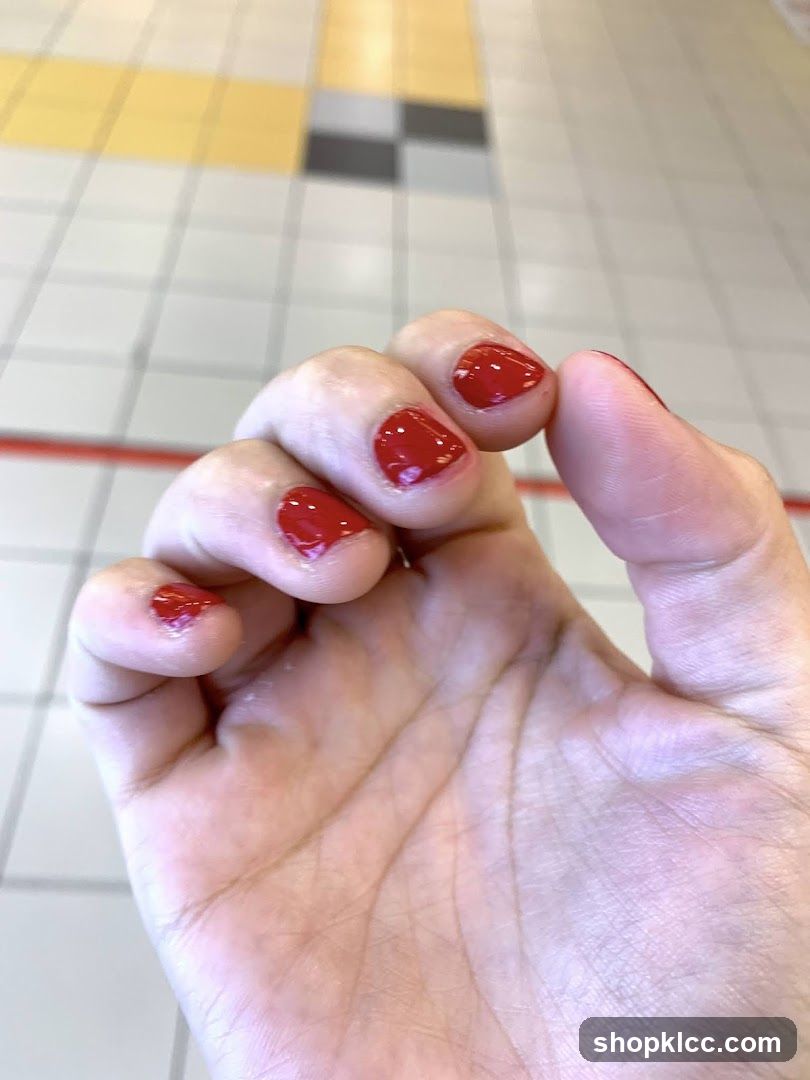 Red Nail Polish on Hand