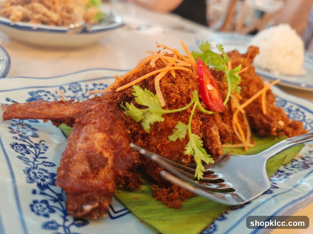Fried Chicken Wings with Shredded Carrots and Cilantro