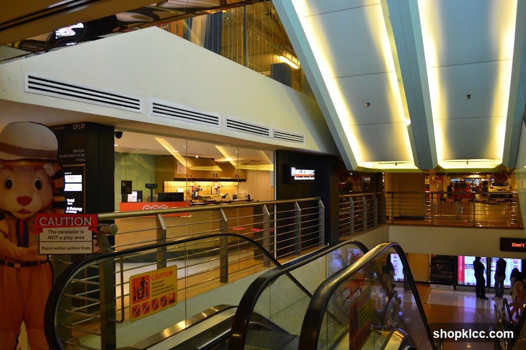 Mall Interior with Escalators and Food Stalls