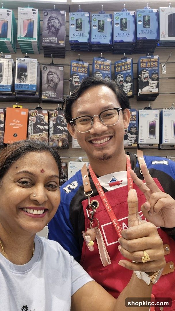 Customers and Staff in Electronics Store
