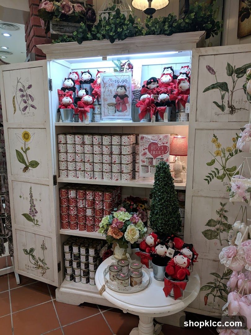 Display cabinet with dolls and decorative items