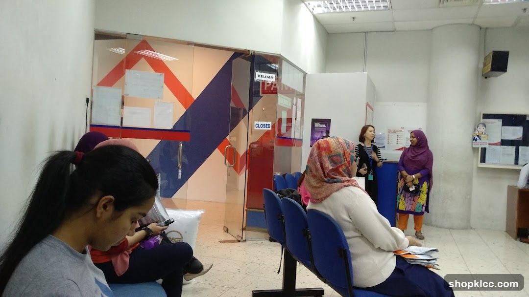 People waiting in a post office