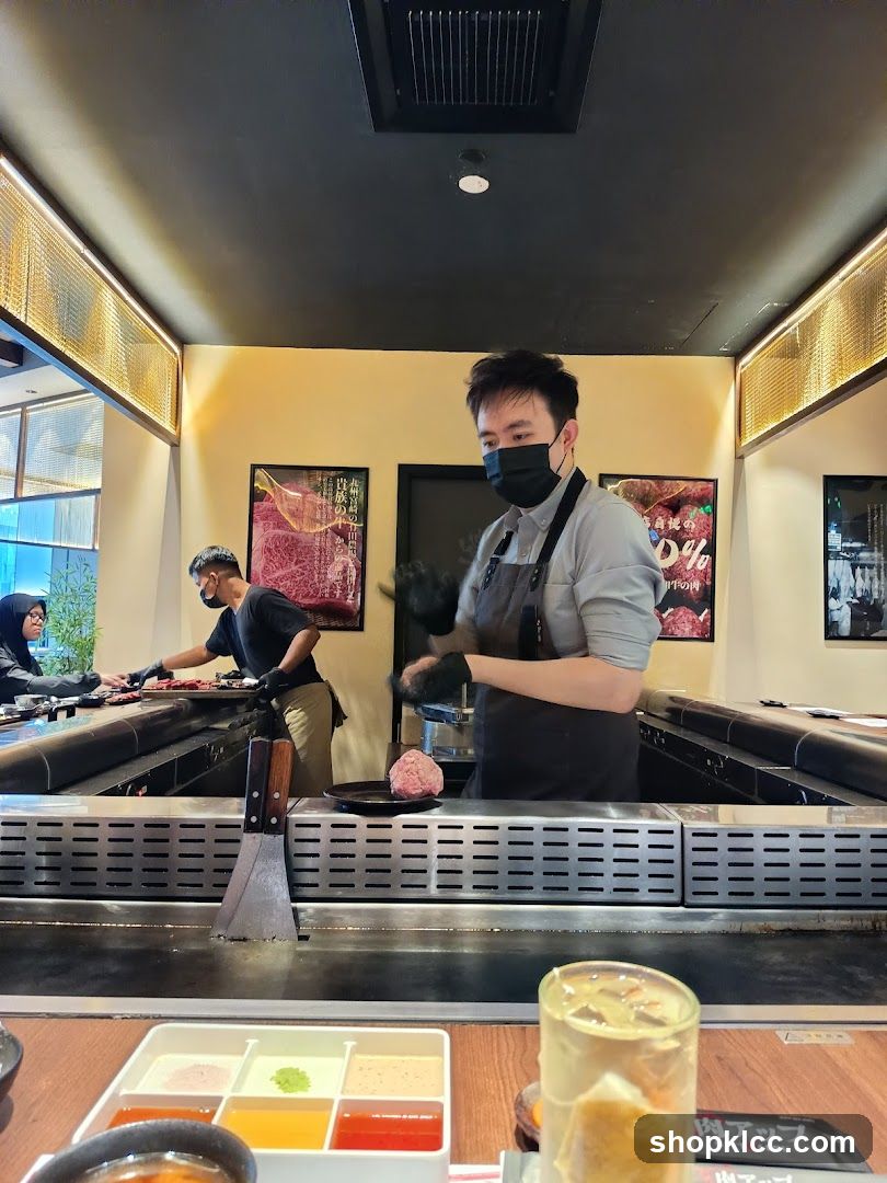 Chefs preparing food at a teppanyaki grill