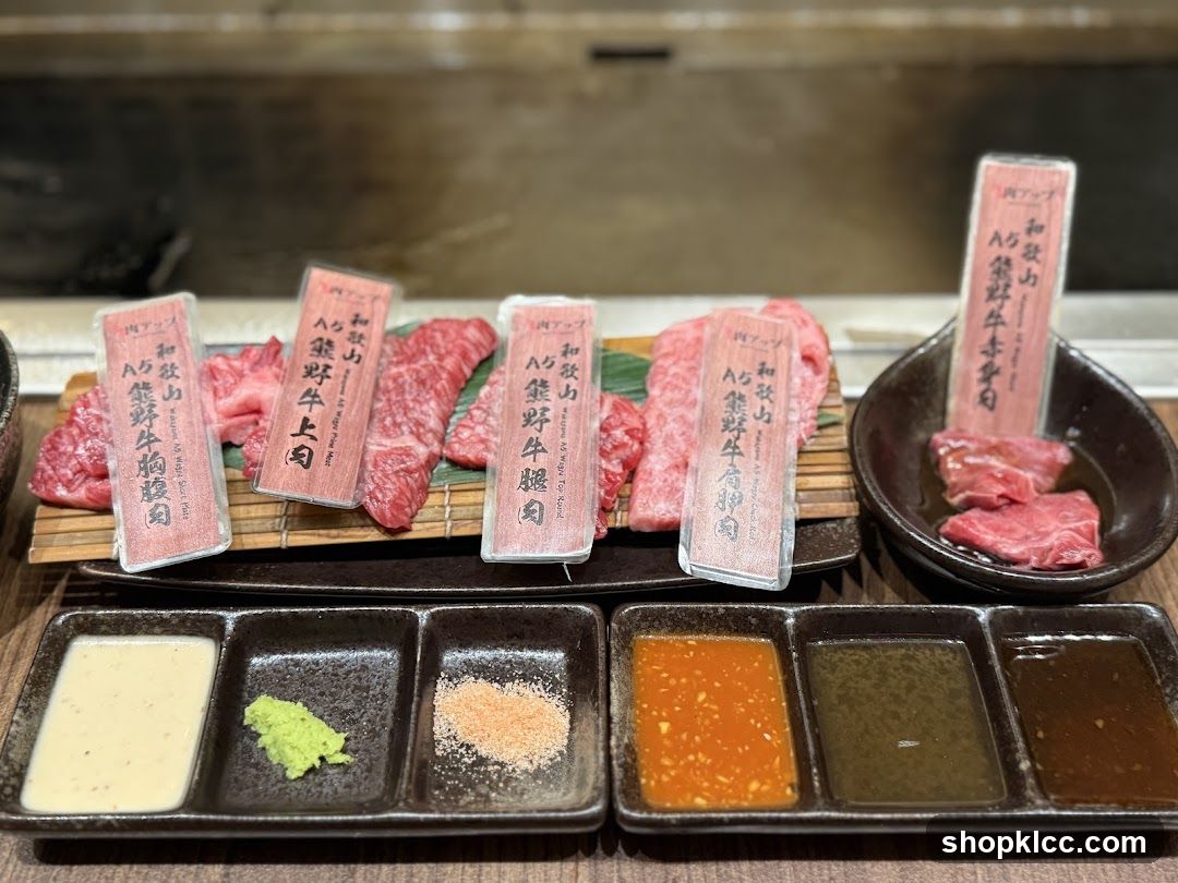 Assortment of Raw Beef Cuts with Dipping Sauces