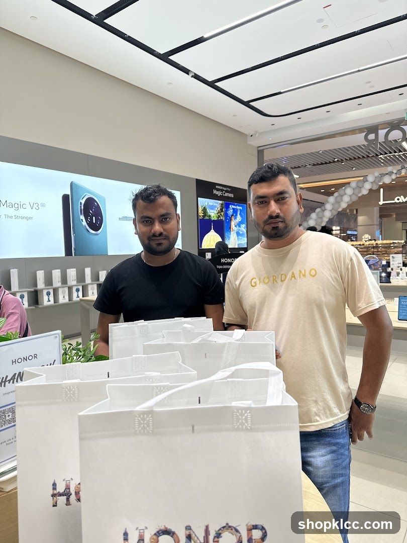 Two men in a store with shopping bags