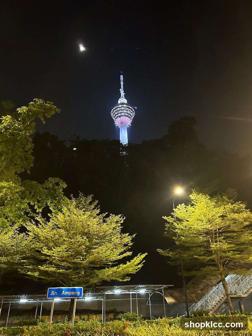Night view of a tower and street sign