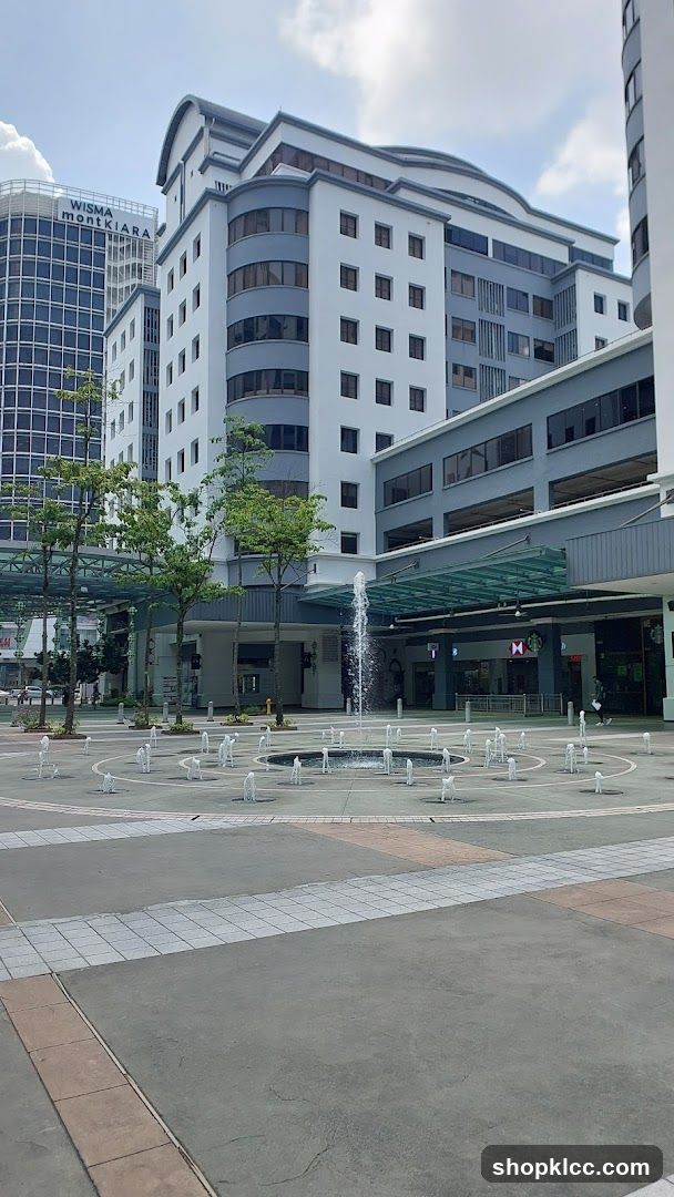 Outdoor plaza with fountains and buildings