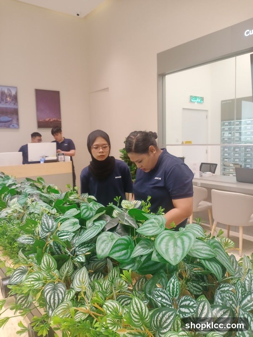 Employees tending to plants