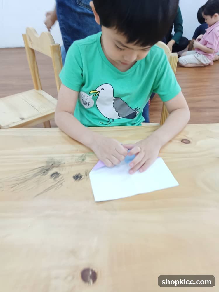 Child folding paper