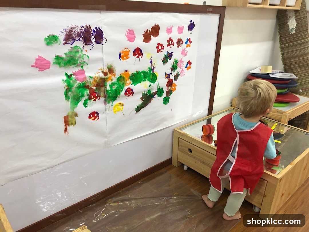 Child painting on large paper