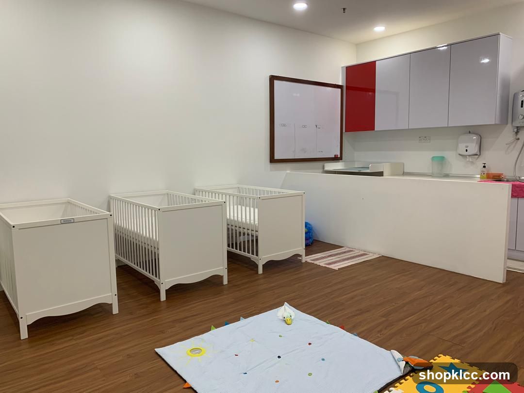Nursery Room with Cribs and Changing Station