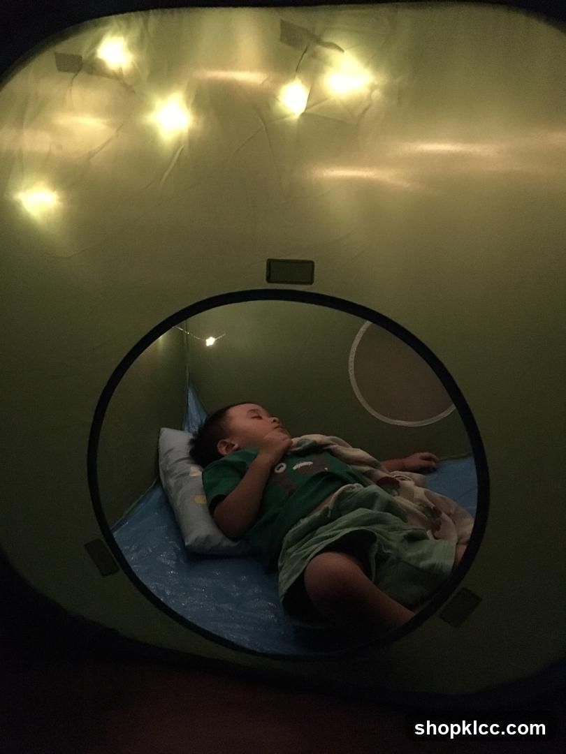 Child sleeping in a tent