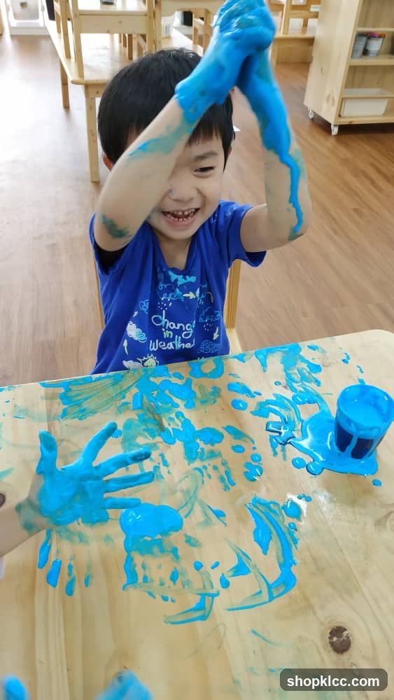 Child Painting with Blue Slime