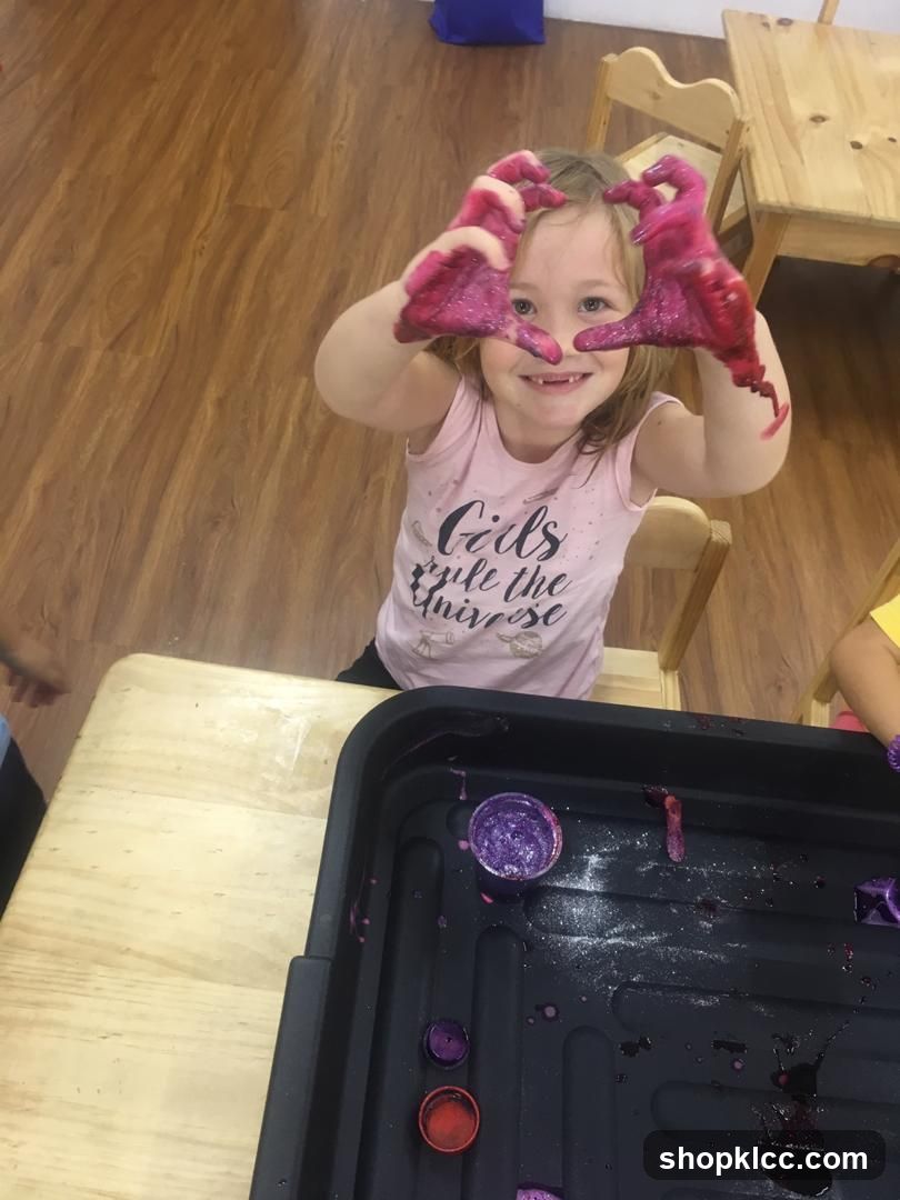 Child with glittery hands