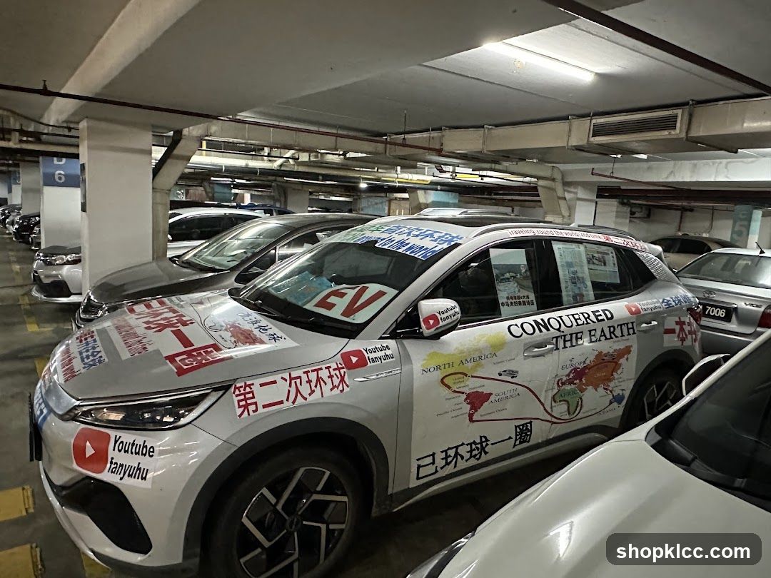 Car decorated with world map and YouTube channel stickers