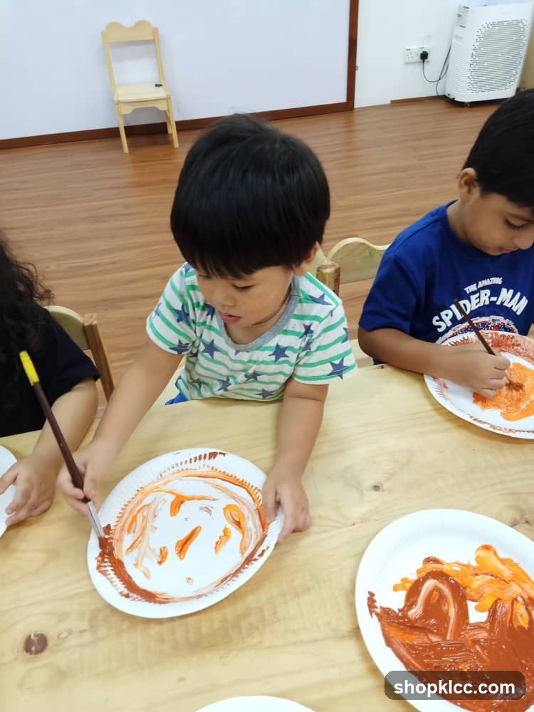 Children painting on paper plates