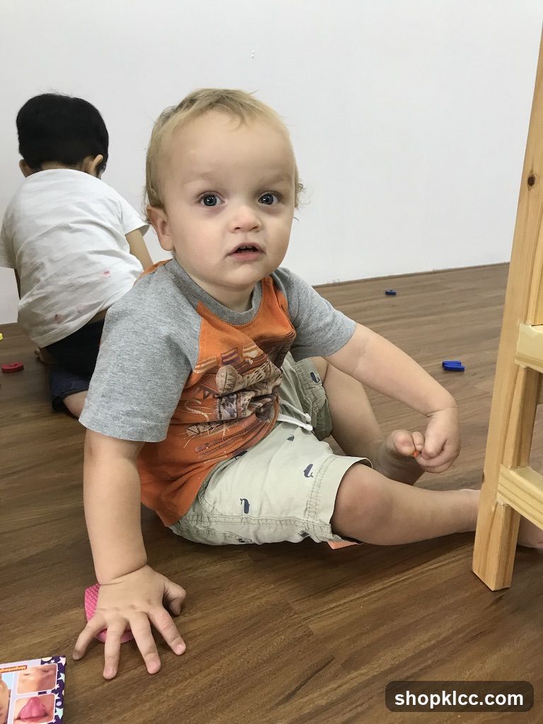 Toddler Sitting on Floor