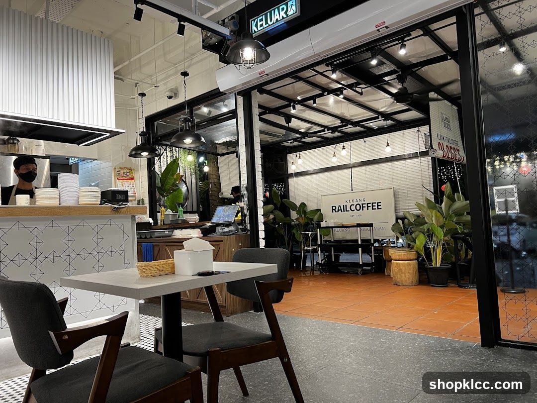 Interior of a cafe with seating and kitchen area