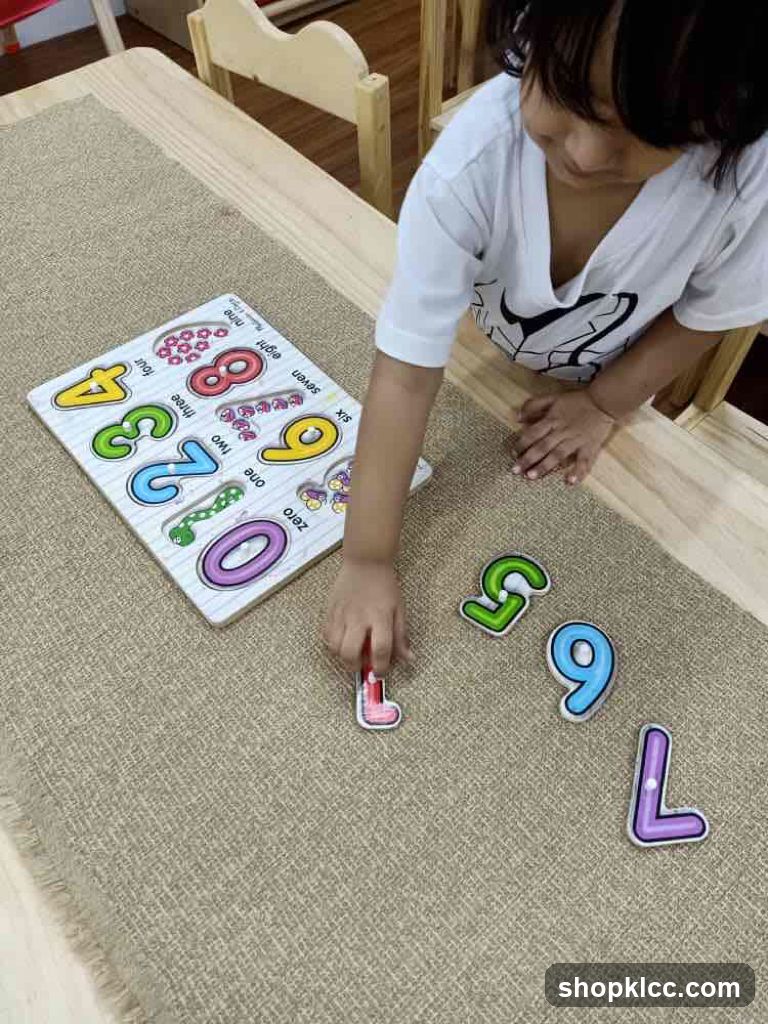 Child playing with number puzzle