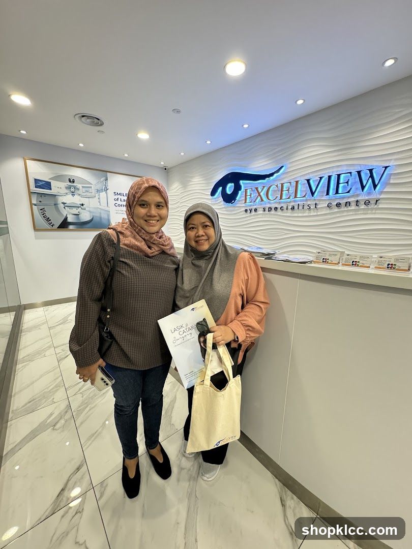 Two women in front of an eye specialist center