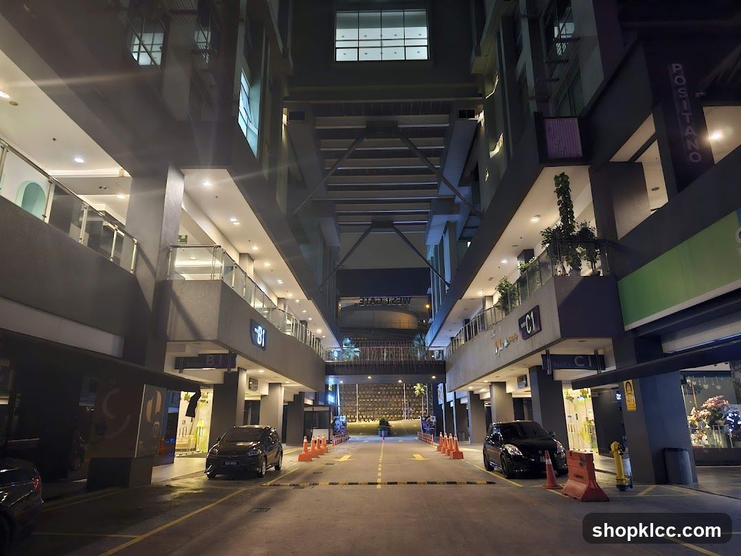 Night view of a multi-level shopping complex entrance