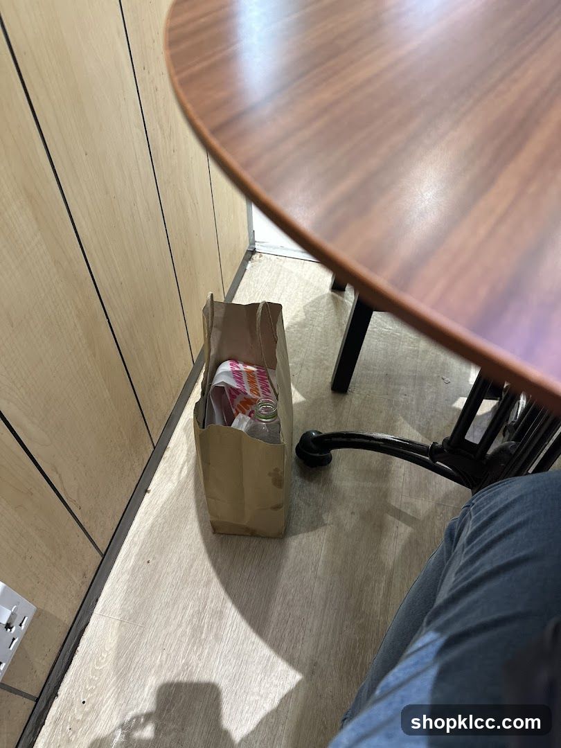 Dunkin' Bag and Bottle Under Table