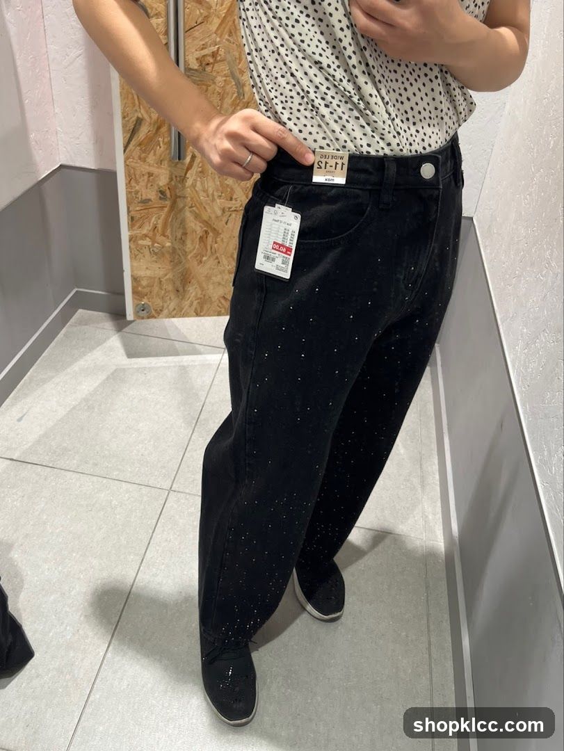 Woman trying on embellished jeans