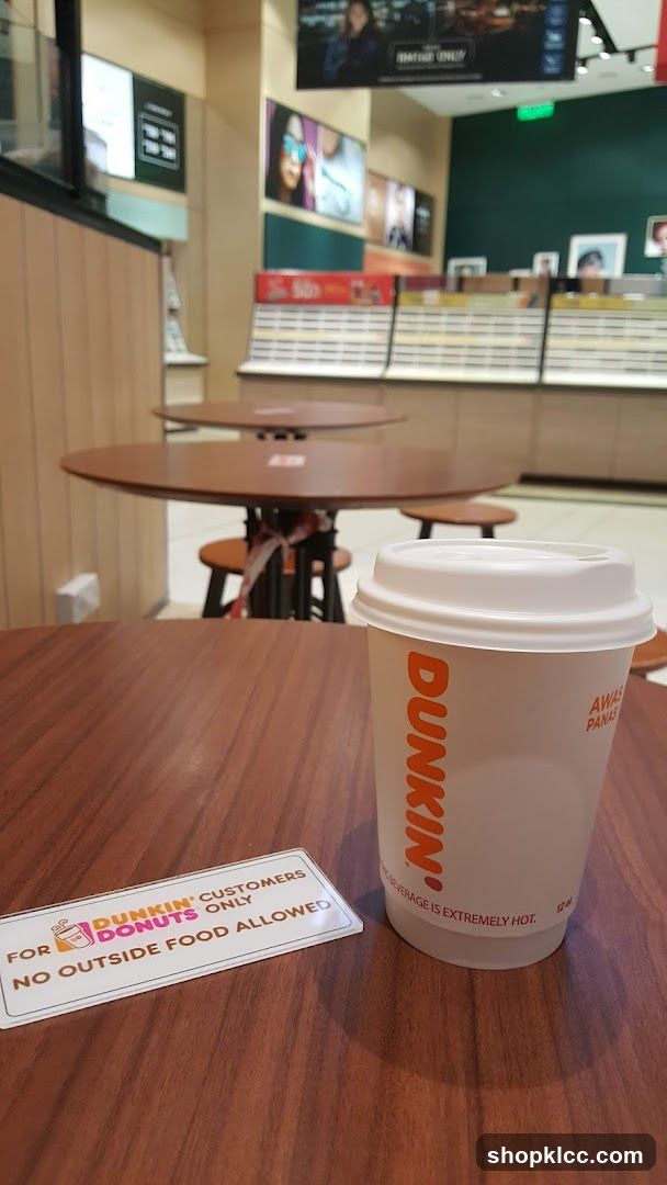 Dunkin' Coffee Cup and Sign