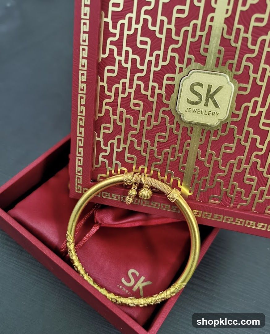 Gold Bangle with SK Jewellery Packaging