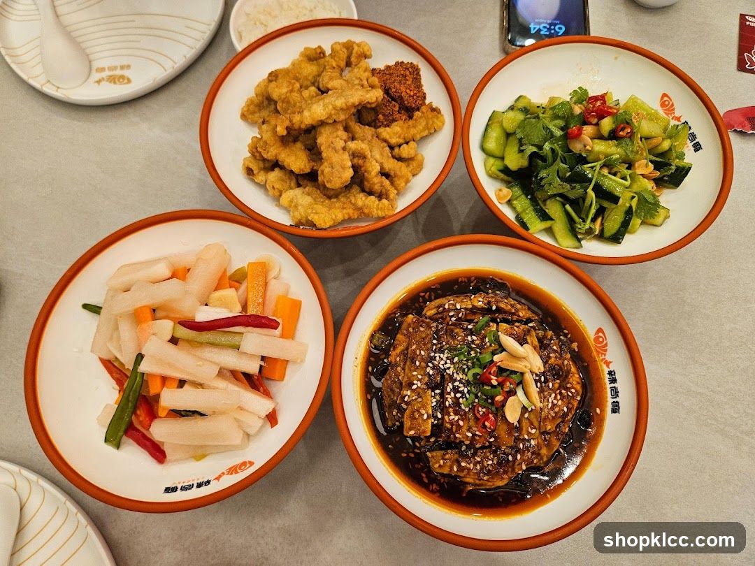 Four dishes of food on a table