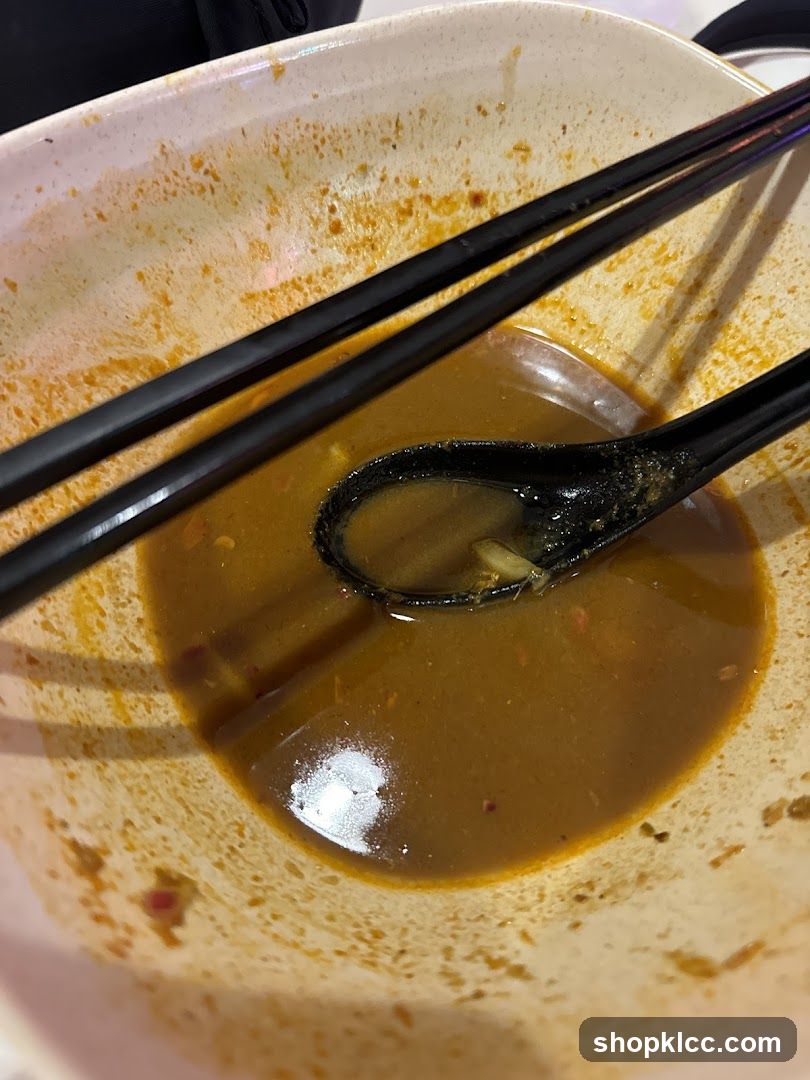 Empty Bowl with Soup and Utensils