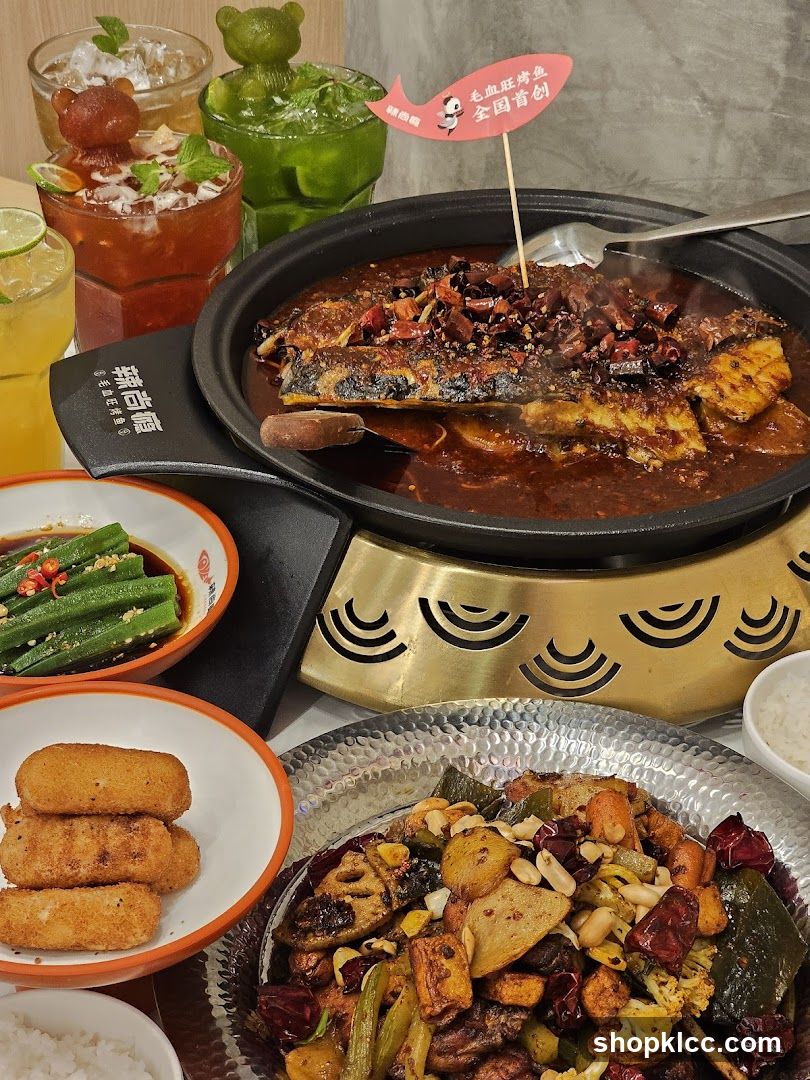Spicy Fish Dish with Drinks and Sides