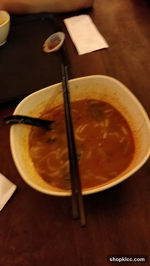 Bowl of Soup with Chopsticks