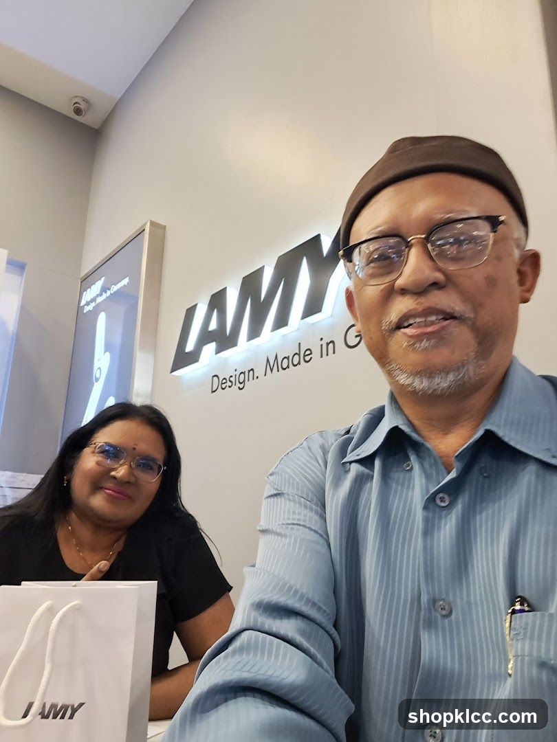 People in front of Lamy Sign