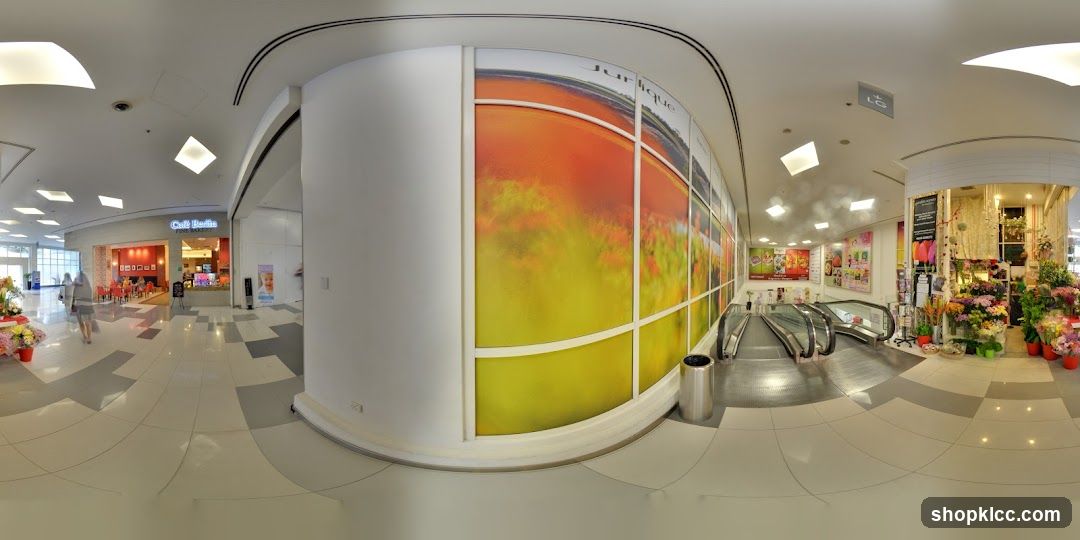 Shopping Mall Interior with Shops and Escalators