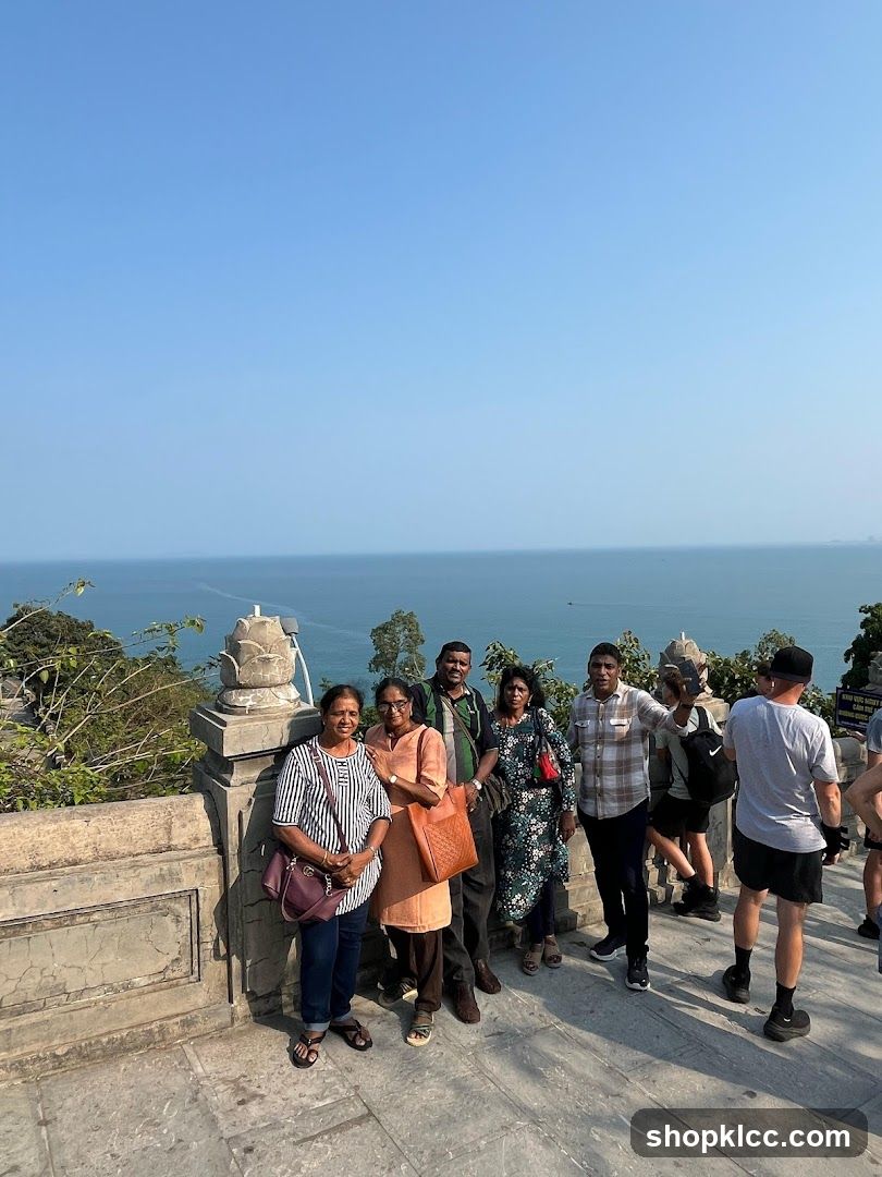 Group posing with ocean view