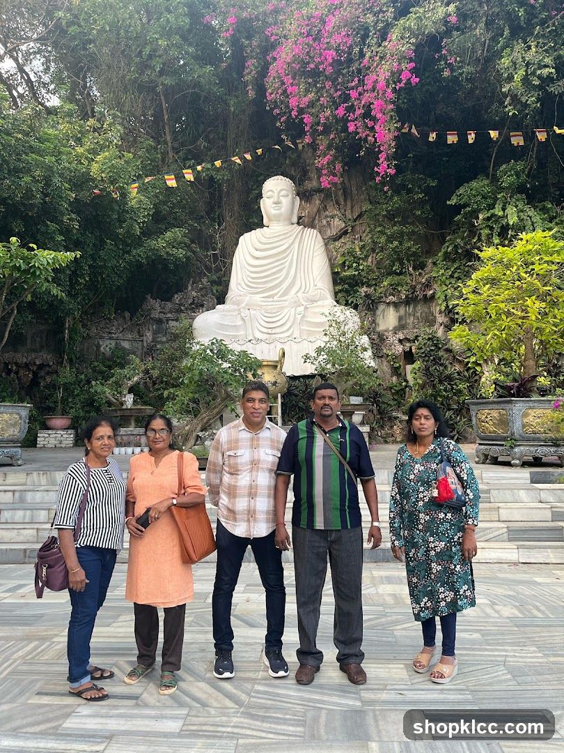Group Poses in Front of a Large Buddha Statue