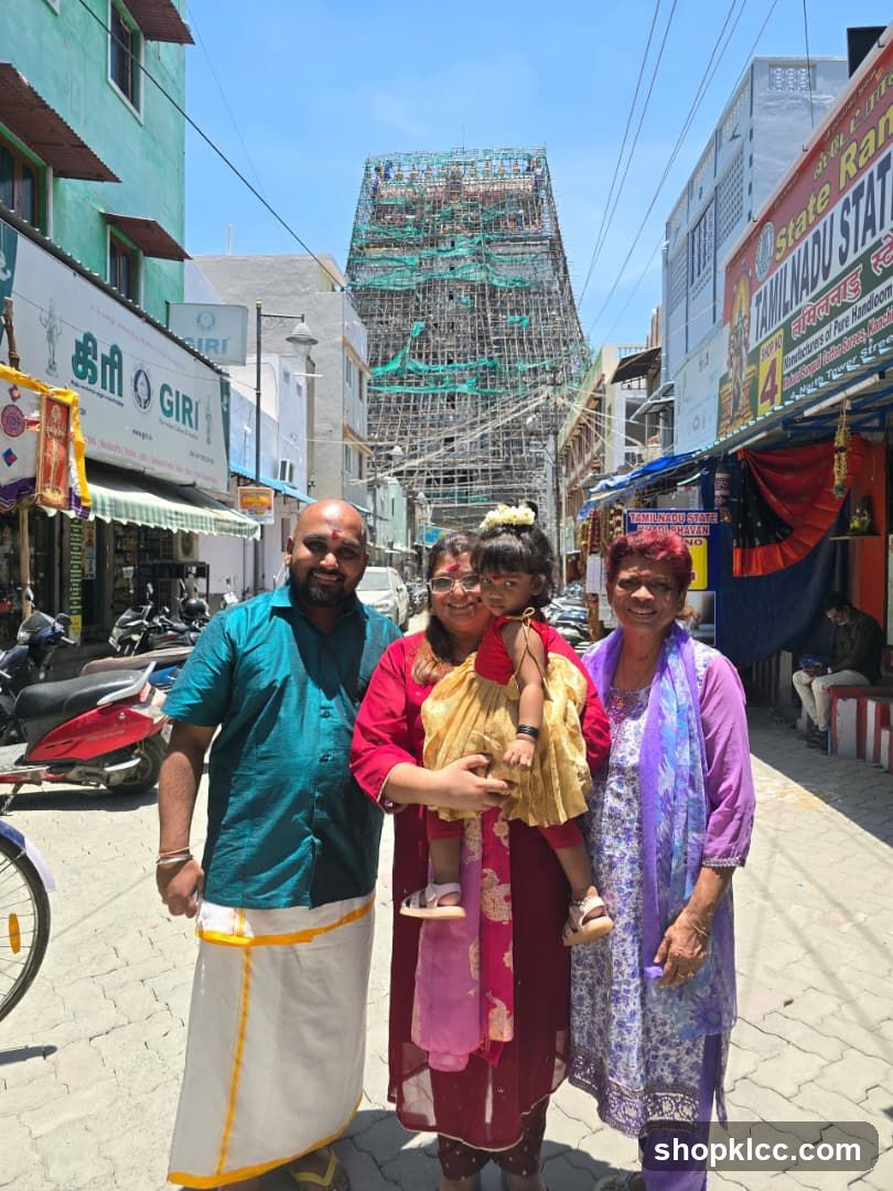 Family Poses in Front of Temple Undergoing Renovation