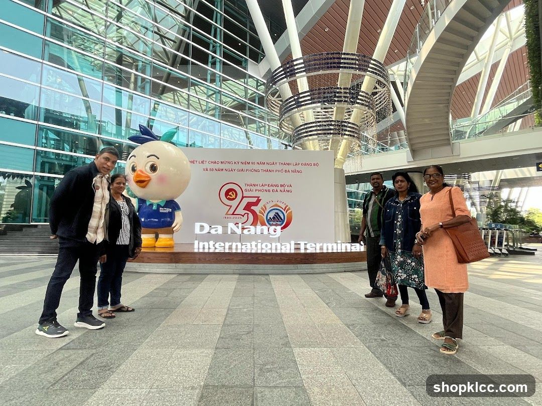 People Posing in Front of Da Nang International Terminal