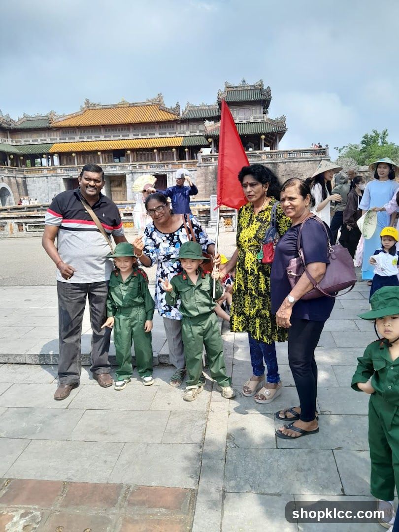 Family posing in front of a historic building