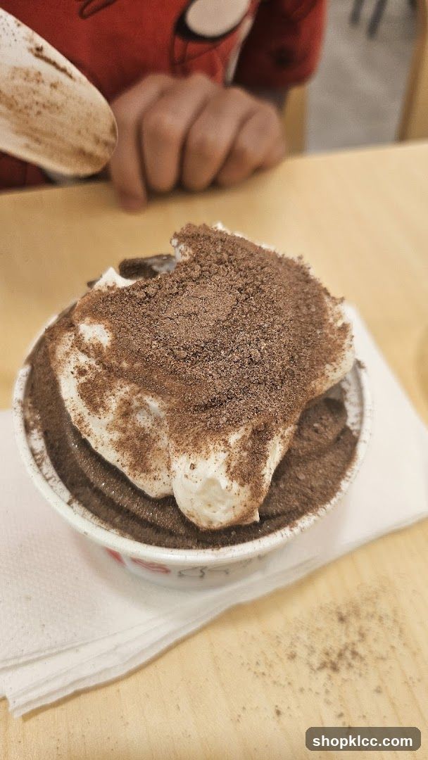 Dessert with Whipped Cream and Chocolate Powder