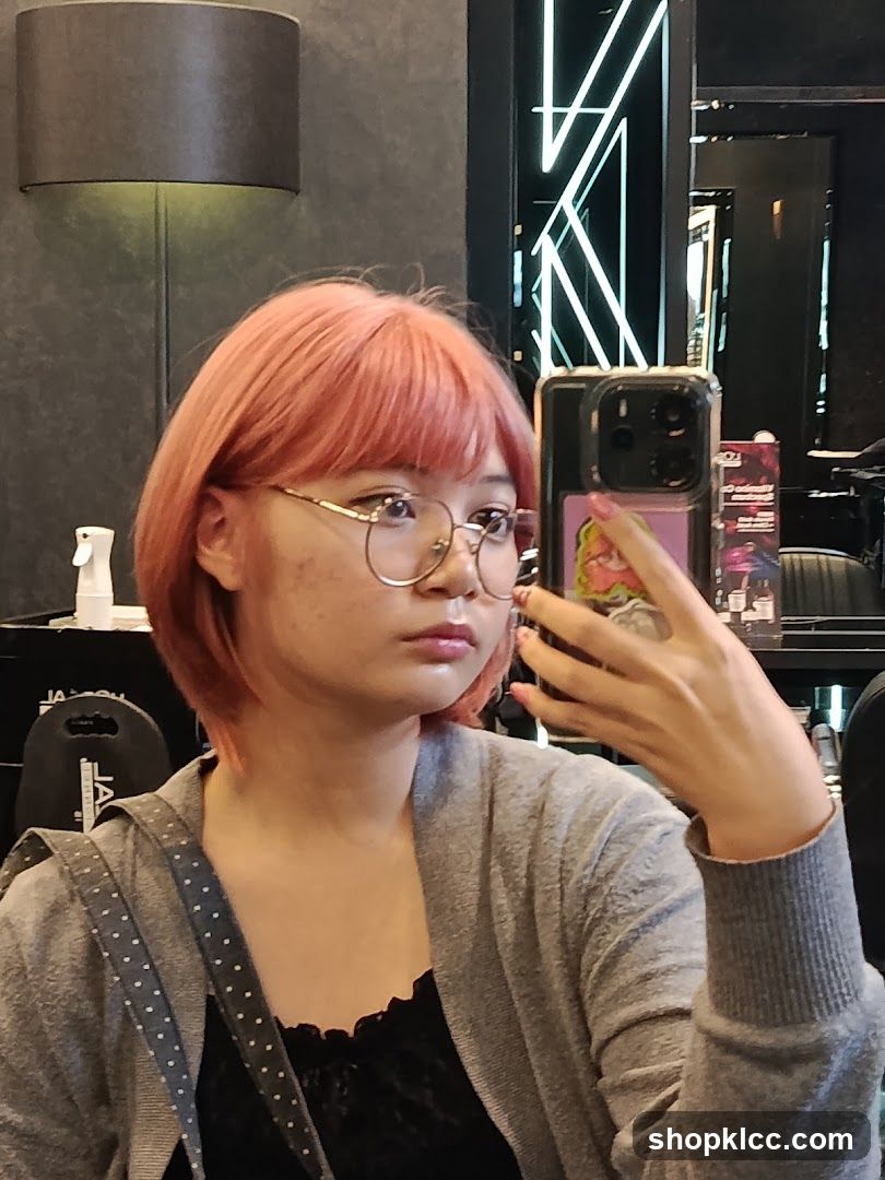 Woman taking a selfie in a salon