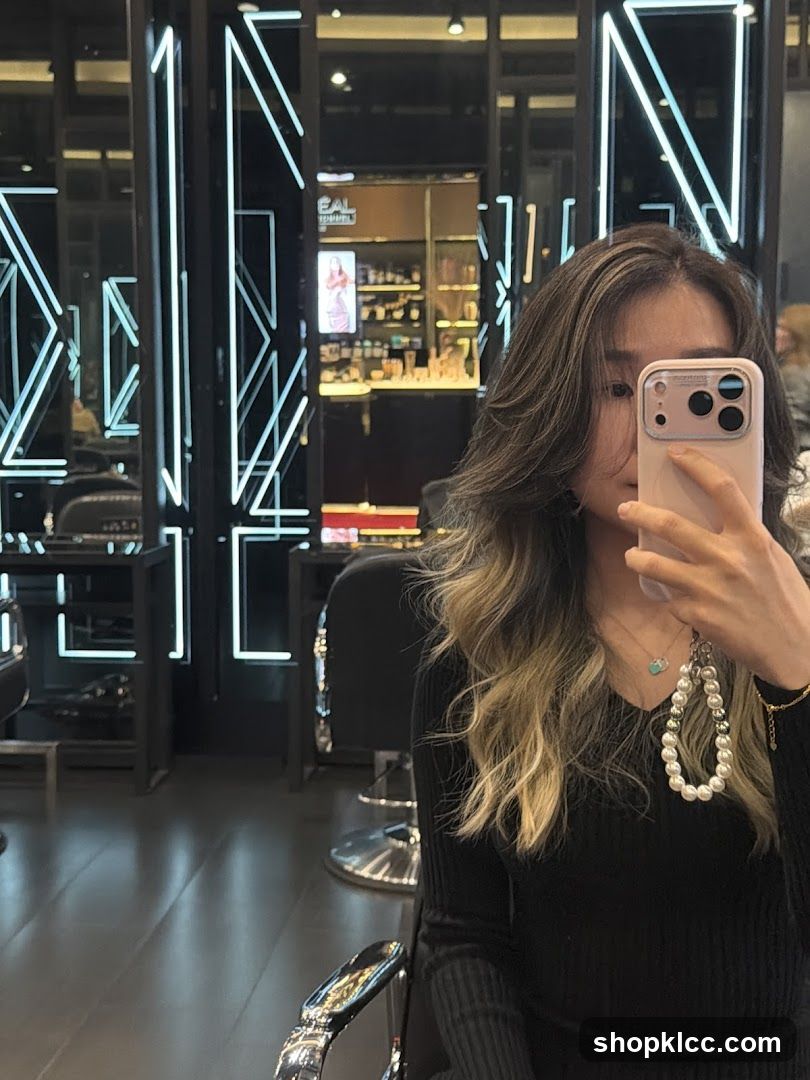 Woman taking a selfie in a salon