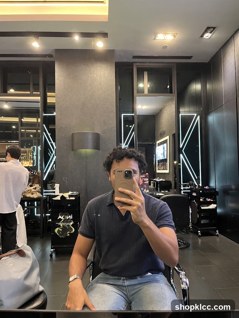 Man taking a selfie in a salon