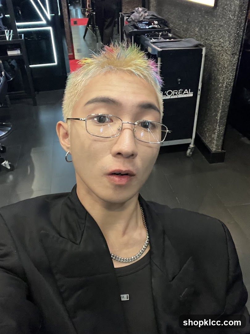 Man with colorful hair in a salon
